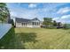 Large backyard with an expansive lawn, sunroom and new wood deck, great for entertaining at 1315 Hazy Falls Blvd, Westfield, IN 46074