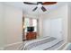 Comfortable bedroom with a wooden ceiling fan, a TV on top of a chest and closet space at 1315 Hazy Falls Blvd, Westfield, IN 46074