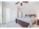 Cozy bedroom featuring a ceiling fan, a large bed and an ample closet space at 1315 Hazy Falls Blvd, Westfield, IN 46074