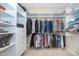 Spacious walk-in closet with custom shelves and hanging rods for optimal organization at 1315 Hazy Falls Blvd, Westfield, IN 46074