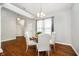 Bright dining room with hardwood floors, modern chandelier, and ample natural light at 1315 Hazy Falls Blvd, Westfield, IN 46074