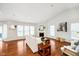 Open living room featuring a fireplace, hardwood floors, and a view to the backyard at 1315 Hazy Falls Blvd, Westfield, IN 46074