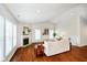 Bright living room featuring hardwood floors, a fireplace, and an abundance of natural light at 1315 Hazy Falls Blvd, Westfield, IN 46074