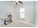 Bright room, with a sewing table, a window with blinds and off-white walls at 1315 Hazy Falls Blvd, Westfield, IN 46074