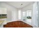 Bright breakfast nook area with door to outside living area and hardwood floors at 1315 Hazy Falls Blvd, Westfield, IN 46074