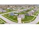 Real estate listing showcasing an aerial view of a lovely home with manicured lawn at 1334 Winfield Way, Greenwood, IN 46143