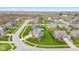 Real estate image showing a neighborhood with single-Gathering homes and well-kept yards at 1334 Winfield Way, Greenwood, IN 46143