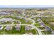 A picturesque aerial view of a residential area featuring well-maintained homes and a scenic pond at 1334 Winfield Way, Greenwood, IN 46143