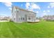 Back of the house featuring a large, green lawn and deck, perfect for relaxation and entertainment at 1334 Winfield Way, Greenwood, IN 46143
