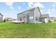 View of the back of house showing the deck and access to the large manicured lawn at 1334 Winfield Way, Greenwood, IN 46143
