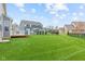 Large manicured backyard with privacy fence, deck, and in ground pool in a suburban neighborhood at 1334 Winfield Way, Greenwood, IN 46143