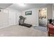 This basement area features a treadmill, an egress window, and access to unfinished storage at 1334 Winfield Way, Greenwood, IN 46143