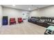Spacious finished basement features leather recliners and colorful chairs for flexible relaxation at 1334 Winfield Way, Greenwood, IN 46143