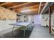 Finished basement featuring a ping pong table, offering entertainment and recreation space at 1334 Winfield Way, Greenwood, IN 46143