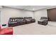 Finished basement with plush seating and a projector screen, ideal for entertainment and relaxation at 1334 Winfield Way, Greenwood, IN 46143