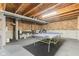 Finished basement with a ping pong table, perfect for Gathering fun and recreation at 1334 Winfield Way, Greenwood, IN 46143