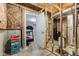 Partially finished basement with an open door revealing an exercise area with a treadmill at 1334 Winfield Way, Greenwood, IN 46143