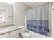 Bathroom with a shower and tub combo, granite counters and modern sink and faucet fixtures at 1334 Winfield Way, Greenwood, IN 46143