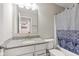 Bathroom showcasing granite counter tops, modern sink, shower and tub combo with blue curtain at 1334 Winfield Way, Greenwood, IN 46143