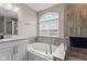 Bright bathroom with a large garden tub, shower and granite countertops at 1334 Winfield Way, Greenwood, IN 46143