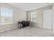 Well-lit bedroom with neutral walls, carpet flooring, and two windows offering natural light at 1334 Winfield Way, Greenwood, IN 46143