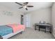 Cozy bedroom featuring a ceiling fan, carpet flooring and a combo bath/laundry room at 1334 Winfield Way, Greenwood, IN 46143