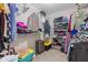 Walk-in closet with ample shelving and hanging space for storage at 1334 Winfield Way, Greenwood, IN 46143
