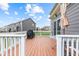 Outdoor deck featuring patio furniture and a grill with views of the lush backyard at 1334 Winfield Way, Greenwood, IN 46143
