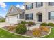 Charming two-story brick home with well-manicured landscaping, and a three car garage at 1334 Winfield Way, Greenwood, IN 46143