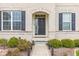 Close up of the home's front entrance with well maintained landscaping at 1334 Winfield Way, Greenwood, IN 46143