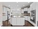 Spacious kitchen features white cabinets, granite countertops, and stainless steel appliances at 1334 Winfield Way, Greenwood, IN 46143