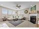 Spacious living room with a modern fireplace, carpet, and large windows for natural light at 1334 Winfield Way, Greenwood, IN 46143