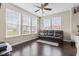 Bright living room with hardwood floors, large windows and comfortable seating at 1334 Winfield Way, Greenwood, IN 46143
