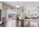 An open floor plan with beautiful hardwood flooring connects to a bright living room at 1334 Winfield Way, Greenwood, IN 46143