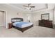 Spacious main bedroom with a comfortable bed, dresser, and soft carpet at 1334 Winfield Way, Greenwood, IN 46143
