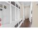 Mudroom with storage cubbies, coat hooks, bench seat and view of hallway at 1334 Winfield Way, Greenwood, IN 46143