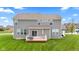The back of the home has a beautiful wood deck and sliding glass doors at 1334 Winfield Way, Greenwood, IN 46143