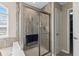 Elegant tiled shower with a glass door and modern fixtures at 1334 Winfield Way, Greenwood, IN 46143