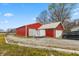 Exterior view of the barn, trailer, and car on the property at 1502 N Matthews Rd, Greenwood, IN 46143