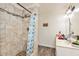 Bathroom featuring tiled shower and vanity with decorative fixtures at 1502 N Matthews Rd, Greenwood, IN 46143