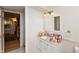 Well-lit bathroom featuring a white vanity, sink, and mirror with modern lighting at 1502 N Matthews Rd, Greenwood, IN 46143