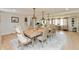 Elegant dining room with a large table, stylish chairs, pendant lighting, and a cozy atmosphere at 1502 N Matthews Rd, Greenwood, IN 46143