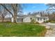 Charming single-story home with bright white painted brick and a beautifully landscaped front yard at 1502 N Matthews Rd, Greenwood, IN 46143