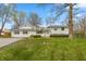 Charming one-story home with well-maintained lawn and mature trees at 1502 N Matthews Rd, Greenwood, IN 46143