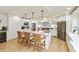 Bright kitchen featuring white cabinets, island, marble countertops, and stainless appliances at 1502 N Matthews Rd, Greenwood, IN 46143
