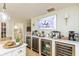 Kitchen bar area with beverage fridges and coffee bar setup at 1502 N Matthews Rd, Greenwood, IN 46143