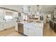 Bright kitchen with island, stainless steel appliances, pendant lights and farmhouse sink at 1502 N Matthews Rd, Greenwood, IN 46143