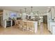 Spacious kitchen with island, hardwood floors, and modern lighting at 1502 N Matthews Rd, Greenwood, IN 46143