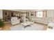 Spacious living area featuring hardwood floors, comfortable seating, and lots of natural light from the windows at 1502 N Matthews Rd, Greenwood, IN 46143