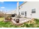 Fenced backyard featuring a patio with dining table and landscaping at 15144 Dry Creek Rd, Noblesville, IN 46060